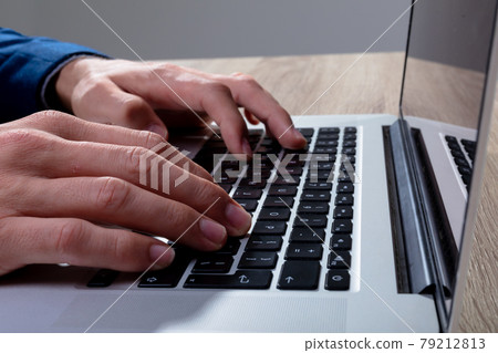 Midsection of caucasian businessman typing on keyboard, isolated on grey background 79212813