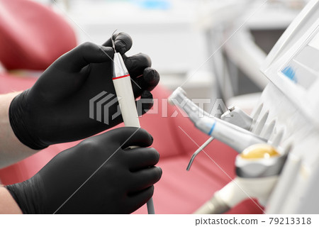 Dentist's office: modern equipment and instruments. Treatment in a dental clinic. Close-up. Dentist's office: modern equipment and instruments. Treatment in a dental clinic. Close-up. 79213318