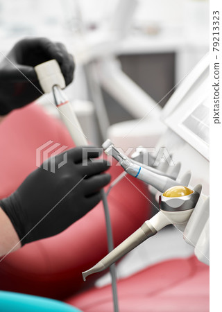 Different dental instruments and tools in a dentists office Different dental instruments and tools in a dentists office 79213323