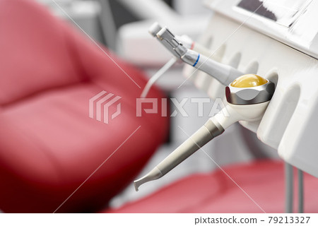 Different dental instruments and tools in a dentists office Different dental instruments and tools in a dentists office 79213327