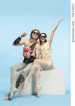 Movie lover. Young couple of ballet dancers in ancient Rome costums at blue studio. Movie lover. Young couple of ballet dancers in ancient Rome costums at blue studio. 79214931