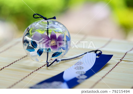Wind chimes placed on the bamboo blinds on the porch 10 79215494