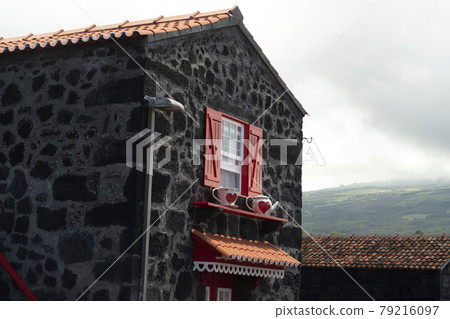 Lajido village Pico Island Azores black lava houses red windows 79216097