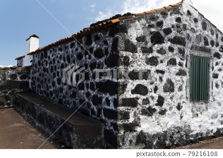 Lajido village Pico Island Azores black lava houses red windows Lajido village Pico Island Azores black lava houses red windows 79216108