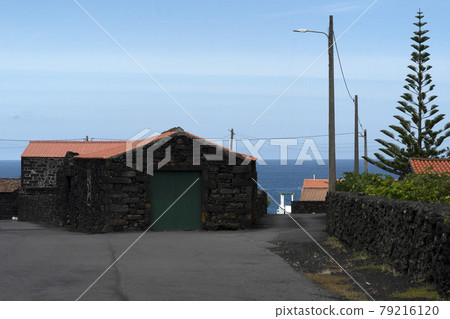 Lajido village Pico Island Azores black lava houses red windows 79216120