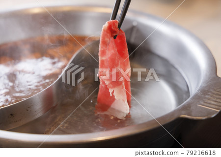 Delicious meat dish made in an iron pan 79216618