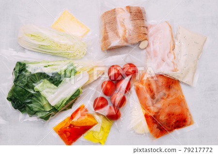 Salad dinner set: chicken, lettuce, tomatoes, peking cabbage, cheese, bacon, bread, olive oil sauces and spices. A set for delivering food for dinner on a white background. I cook at home. Salad dinner set: chicken, lettuce, tomatoes, peking cabbage, cheese, bacon, bread, olive oil sauces and spices. A set for delivering food for dinner on a white background. I cook at home. 79217772