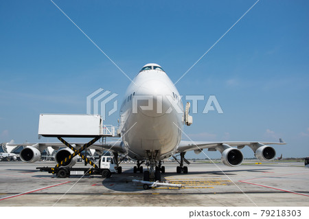 Airplane near the terminal in an airport Airplane near the terminal in an airport 79218303