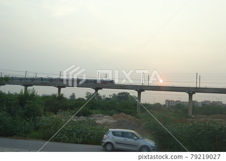 Train and sunset running in the capital of India Train and sunset running in the capital of India 79219027