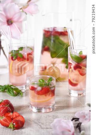 Strawberry summer cocktail with basil 79219434