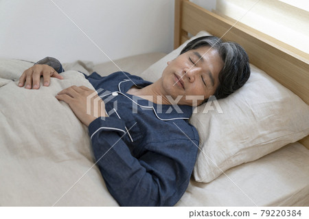 Sleeping man in his 50s sleeping face Sleeping man in his 50s sleeping face 79220384