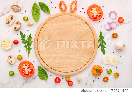 The ingredients for homemade pizza set up on white marble background. 79221491