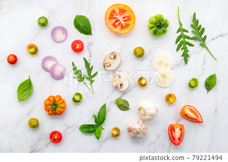 The ingredients for homemade pizza set up on white marble background. 79221494