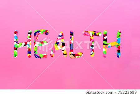 Pills in capsules in the form of the text Health on a pink background. Pills in capsules in the form of the text Health on a pink background. 79222699