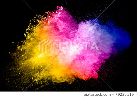 Multicolored particle exploding on black background. Colorful dust splashing. 79223119
