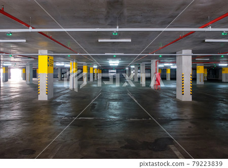The Empty parking lot with the green signal light in the parking building. 79223839