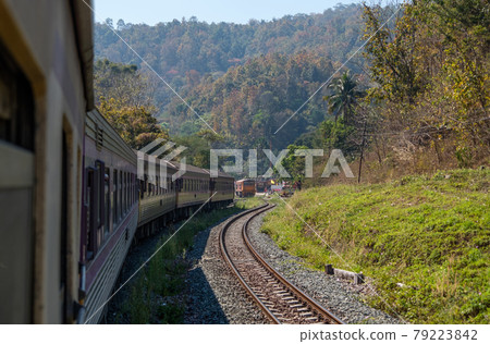 View from the rear of a special express train that leaves from the small station. View from the rear of a special express train that leaves from the small station. 79223842