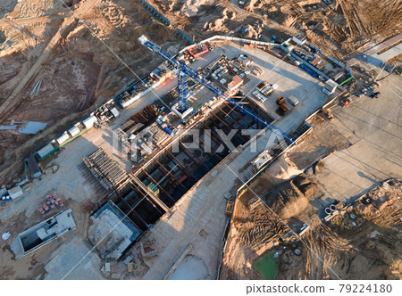 Aerial view of the construction of the subway. Tower crane in action during the construction Aerial view of the construction of the subway. Tower crane in action during the construction 79224180