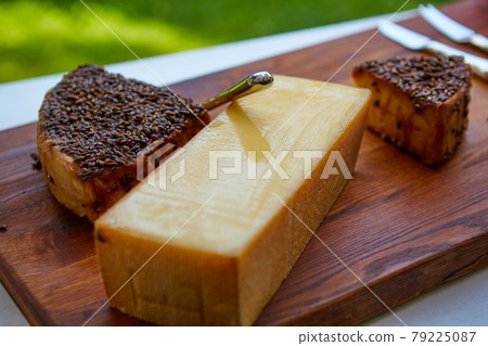 Cheese party table, perfect holiday appetizer on rustic wooden board 79225087