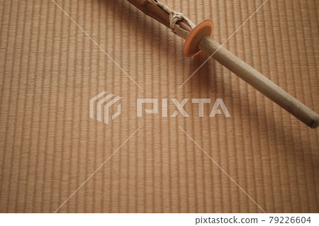 A quiet bamboo sword placed on a tatami mat A quiet bamboo sword placed on a tatami mat 79226604