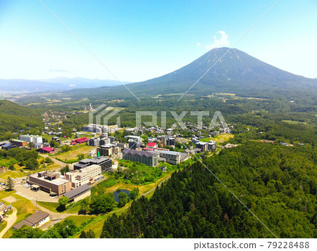 Aerial view of Mt. Yotei and cityscape at Hirafu, Kutchan-cho, Hokkaido in early summer 79228488