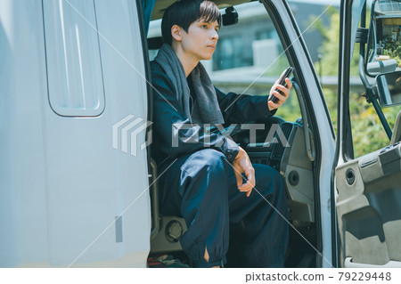 Truck driver and smartphone Truck driver and smartphone 79229448
