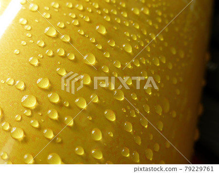 Close up shot of many water drops on a beer can Close up shot of many water drops on a beer can 79229761