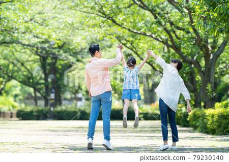 Parent and child walking park elementary school student family image 79230140