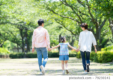 Parent and child walking park elementary school student family image 79230141