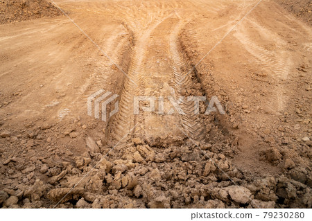 Wheel tracks on the ground. Wheel tracks on the ground. 79230280