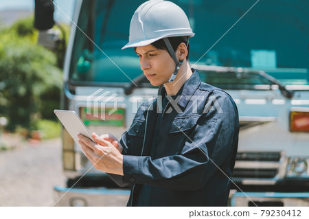 Truck driver and tablet Truck driver and tablet 79230412