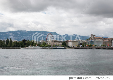 View on Geneva lake, far away mountains and city Geneva, Switzerland View on Geneva lake, far away mountains and city Geneva, Switzerland 79233069