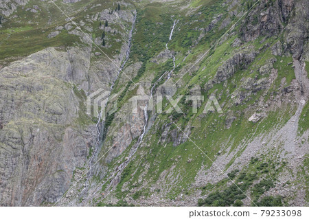 Closeup mountains scenes, walk to Trift Bridge in national park Switzerland Closeup mountains scenes, walk to Trift Bridge in national park Switzerland 79233098