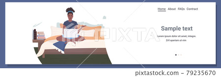 woman freelancer sitting on bed using laptop stay home coronavirus pandemic quarantine concept 79235670