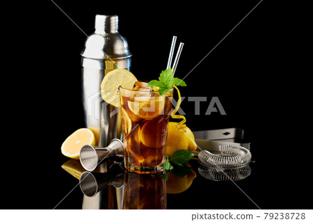 Glass of Fresh Long Island Ice Tea Cocktail - studio shot on black background 79238728