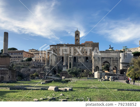 Forum Romanum in Rome, Italy. In a distance Colosseum. 79238852