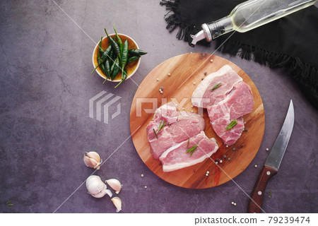 top view of raw meat on chopping board on black background , top view of raw meat on chopping board on black background , 79239474