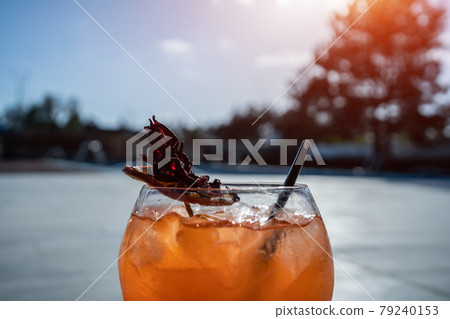close up of fresh orange aperol spritz lychee cocktail with ice in glass outdoor close up of fresh orange aperol spritz lychee cocktail with ice in glass outdoor 79240153
