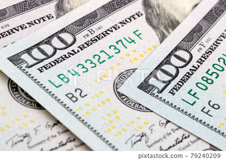 close-up 100 US dollar bills background toned 79240209