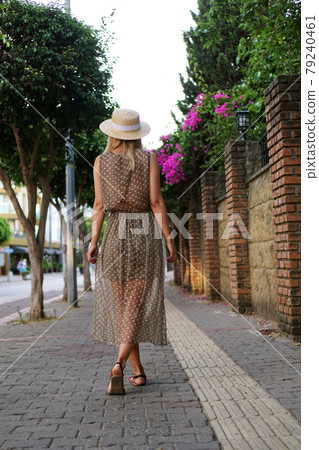 Young pretty girl walking on the summer turkey street Young pretty girl walking on the summer turkey street 79240461