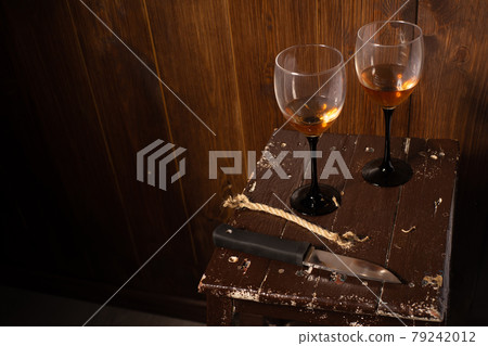 Two glasses of wine, a knife and a piece of rope Two glasses of wine, a knife and a piece of rope 79242012