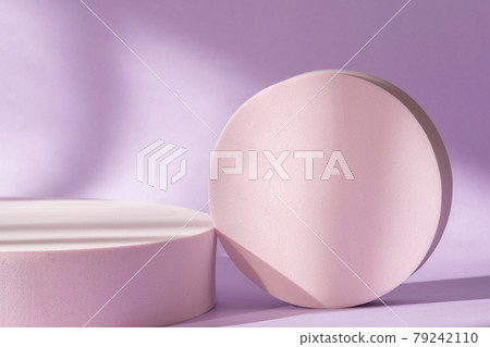 Cosmetic product presentation with shadows and light from windows. Lilac backdrop with pink round podium, display, mockup. Window natural shadow overlay effect on purple surface 79242110