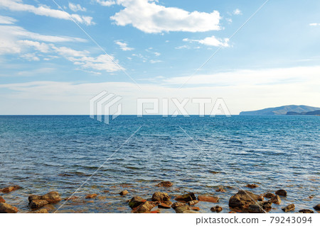 Stony sea shore photo for a background 79243094