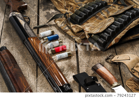 Various hunting equipment on old wooden background Various hunting equipment on old wooden background 79243127