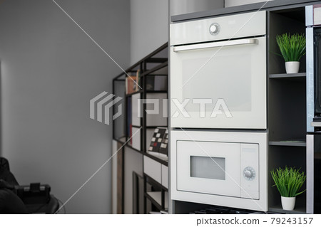 Electrical ovens, home appliances in the store.. 79243157