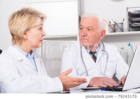 Male doctor and nurse 79243179