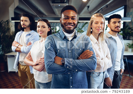 Group portrait of five diverse young colleagues standing in a row in office Group portrait of five diverse young colleagues standing in a row in office 79243189