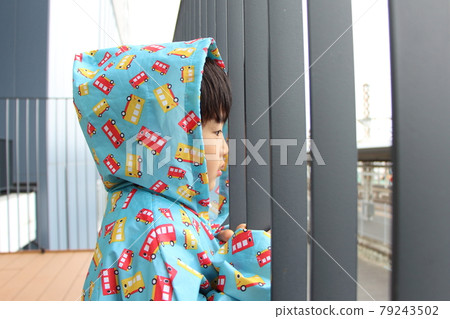 Boy in a raincoat Boy in a raincoat 79243502