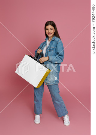 beautiful woman holding shopping bags with purchases beautiful woman holding shopping bags with purchases 79244490