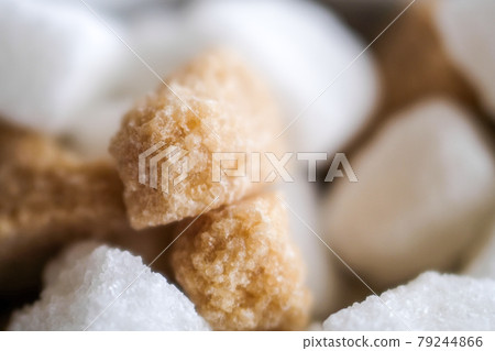 Brown and white sugar cubes background. Close up Brown and white sugar cubes background. Close up 79244866
